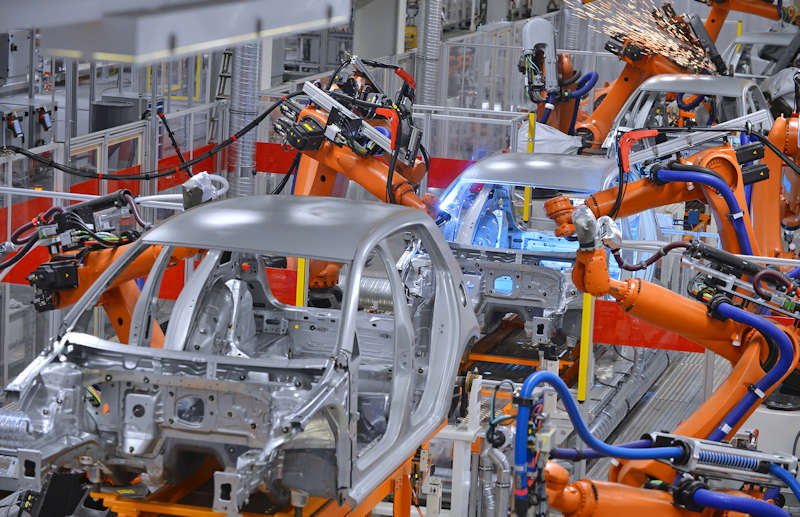 Robots performing repetitive welding in an automobile factory
